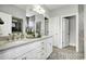 Bathroom featuring double sink vanity, white cabinets, tiled floors, and a shower tub at 872 Fowler Rd., Conway, SC 29526