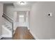 Bright foyer with hardwood floors, white wainscoting, and a staircase on the left at 872 Fowler Rd., Conway, SC 29526