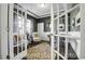 Study with French doors, wainscoting, a patterned rug, and a neutral color palette at 872 Fowler Rd., Conway, SC 29526