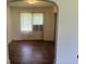 Bedroom with original hardwood floors and a classic archway at 911 Park Ave., Marion, SC 29571