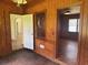 Living room displaying hardwood floors, wood paneling, and doorways to other rooms at 911 Park Ave., Marion, SC 29571