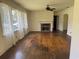 Bright living room featuring hardwood floors and a fireplace at 911 Park Ave., Marion, SC 29571