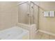 Bathroom features a glass-enclosed shower, soaking tub, and tiled walls at 9994 Beach Club Dr. # 1202, Myrtle Beach, SC 29572
