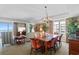 Open-concept dining area with modern lighting, balcony access and comfortable seating at 9994 Beach Club Dr. # 1202, Myrtle Beach, SC 29572