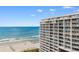 High-rise condo building on the beach, offering stunning ocean views from numerous balconies at 9994 Beach Club Dr. # 1202, Myrtle Beach, SC 29572