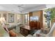 Charming living room with comfortable seating, a TV, and access to a balcony with ocean views at 9994 Beach Club Dr. # 1202, Myrtle Beach, SC 29572