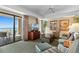 Relaxing living room with comfortable seating and access to an ocean view balcony at 9994 Beach Club Dr. # 1202, Myrtle Beach, SC 29572