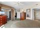 Relaxing main bedroom with ceiling fan, television, balcony access, and view to sitting area at 9994 Beach Club Dr. # 1202, Myrtle Beach, SC 29572
