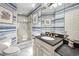 Nautical-themed bathroom with striped wallpaper, glass shower, and elegant fixtures at 100 Ocean Park Loop, Georgetown, SC 29440