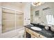Cozy bathroom featuring a glass-door shower and marble countertop vanity at 100 Ocean Park Loop, Georgetown, SC 29440