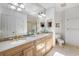 Elegant bathroom featuring double sinks, marble countertop, and gold fixtures at 100 Ocean Park Loop, Georgetown, SC 29440