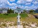 Beautiful beachfront home with private boardwalk access, lush landscaping, and an incredible ocean view at 100 Ocean Park Loop, Georgetown, SC 29440