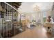 Bright living room featuring a spiral staircase and elegant chandelier at 100 Ocean Park Loop, Georgetown, SC 29440
