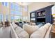 Spacious living room with ocean views, soaring ceilings, a large window, and custom built-ins at 100 Ocean Park Loop, Georgetown, SC 29440
