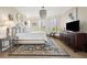 Spacious bedroom with wooden floors, chandelier, and coastal decor at 100 Ocean Park Loop, Georgetown, SC 29440