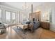 Spacious main bedroom with four-poster bed, light hardwood floors, bright light, and outdoor access at 100 Ocean Park Loop, Georgetown, SC 29440