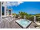 Relaxing backyard deck boasts a hot tub, grill, and ocean views, great for entertaining and enjoying coastal living at 100 Ocean Park Loop, Georgetown, SC 29440