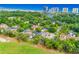 Aerial view of a neighborhood situated next to a golf course and coastline with high-rise buildings at 10056 Kings Rd., Myrtle Beach, SC 29572