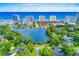 Panoramic aerial view showcasing a serene lake surrounded by lush greenery and neighborhood next to beach at 10056 Kings Rd., Myrtle Beach, SC 29572
