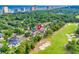 Aerial view of a neighborhood situated next to a golf course and coastline with high-rise buildings at 10056 Kings Rd., Myrtle Beach, SC 29572
