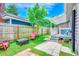 Beautiful backyard with a patio, fire pit, outdoor shower, and mature trees at 10056 Kings Rd., Myrtle Beach, SC 29572