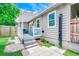 Inviting backyard featuring an outdoor shower, patio, and white pergola for outdoor enjoyment at 10056 Kings Rd., Myrtle Beach, SC 29572