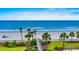 Beautiful ocean and beach view, with lush tropical vegetation and clear blue skies at 10056 Kings Rd., Myrtle Beach, SC 29572