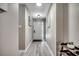 Bright hallway with wood-look floors and neutral paint, leading to various rooms in the home at 10056 Kings Rd., Myrtle Beach, SC 29572