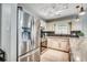 Modern kitchen featuring stainless steel appliances, including a refrigerator and range, complemented by white cabinets at 10056 Kings Rd., Myrtle Beach, SC 29572
