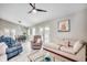 Inviting living room with modern decor, comfortable seating, and an open view into the dining area with ample natural light at 10056 Kings Rd., Myrtle Beach, SC 29572