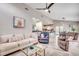 Spacious living room featuring comfortable seating, and an open view into the dining area and kitchen at 10056 Kings Rd., Myrtle Beach, SC 29572