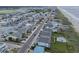 Expansive aerial view of the coastal community, highlighting its proximity to the beach and waterways at 101 W First St. # A2, Ocean Isle Beach, NC 28469