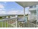 Charming balcony with seating offers views of the pool and beach for a relaxing outdoor experience at 101 W First St. # A2, Ocean Isle Beach, NC 28469