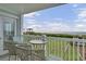 Relaxing balcony showcasing ocean views and outdoor seating, perfect for enjoying the serene surroundings at 101 W First St. # A2, Ocean Isle Beach, NC 28469