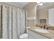 Bathroom featuring a shower/tub combo and granite vanity at 101 W First St. # A2, Ocean Isle Beach, NC 28469