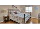 Comfortable bedroom with nautical decor, a queen bed and lots of light at 101 W First St. # A2, Ocean Isle Beach, NC 28469
