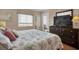Well-lit bedroom with a comfy queen bed and nautical-themed decorations at 101 W First St. # A2, Ocean Isle Beach, NC 28469