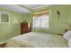 Bright bedroom with a comfortable bed, natural light, and ample space at 101 W First St. # A2, Ocean Isle Beach, NC 28469