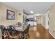 Cozy dining area featuring a wooden table with seating, adjacent to the well-equipped kitchen at 101 W First St. # A2, Ocean Isle Beach, NC 28469