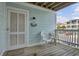 Inviting front porch with seating and charming decor, perfect for enjoying the neighborhood views at 101 W First St. # A2, Ocean Isle Beach, NC 28469