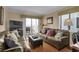 Inviting living room with comfortable leather seating, wooden floors, and balcony overlooking the ocean at 101 W First St. # A2, Ocean Isle Beach, NC 28469