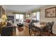 Cozy living room with comfortable seating, a dining table, and sliding doors leading to an ocean-view balcony at 101 W First St. # A2, Ocean Isle Beach, NC 28469