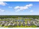 Picturesque neighborhood with a tranquil pond, surrounded by lush greenery and well-manicured lawns at 1029 Saltgrass Way, Myrtle Beach, SC 29588