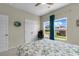 Bright bedroom featuring a ceiling fan, large window, and neutral colored walls at 1029 Saltgrass Way, Myrtle Beach, SC 29588