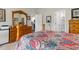 Bedroom featuring a wooden dresser, a four-poster bed, and access to bathroom at 1029 Saltgrass Way, Myrtle Beach, SC 29588