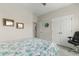 Bedroom featuring bed with floral patterned bedding and a comfortable office chair at 1029 Saltgrass Way, Myrtle Beach, SC 29588