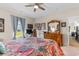 Bedroom featuring a vintage dresser, a four-poster bed, and blue curtains at 1029 Saltgrass Way, Myrtle Beach, SC 29588