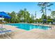 Resort-style community pool with lounge chairs and clear blue water, perfect for relaxation and recreation at 1029 Saltgrass Way, Myrtle Beach, SC 29588