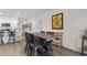 Open dining area featuring a wooden table with seating and modern decor at 1029 Saltgrass Way, Myrtle Beach, SC 29588
