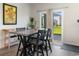 Bright dining area with modern table set and a large sliding glass door overlooking the backyard at 1029 Saltgrass Way, Myrtle Beach, SC 29588